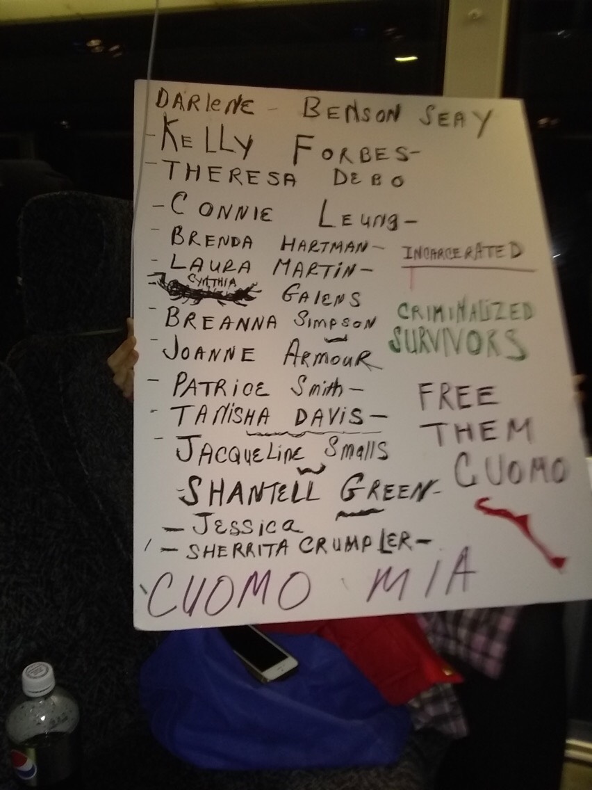 a sign with the words: incarcerated criminalized survivors, free them Cuomo, Cuomo MIA, and the names of the people Survived and Punished demands freedom for. See those names on the stories page of this website